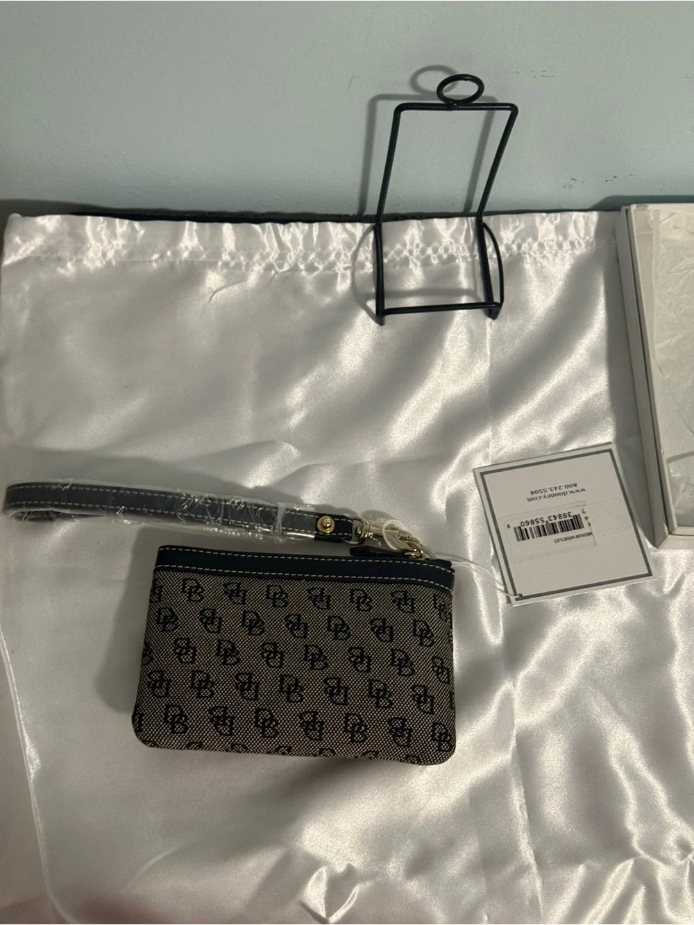 Dooney and Bourke NWT Medium logo wristlet. Comes in a box!
